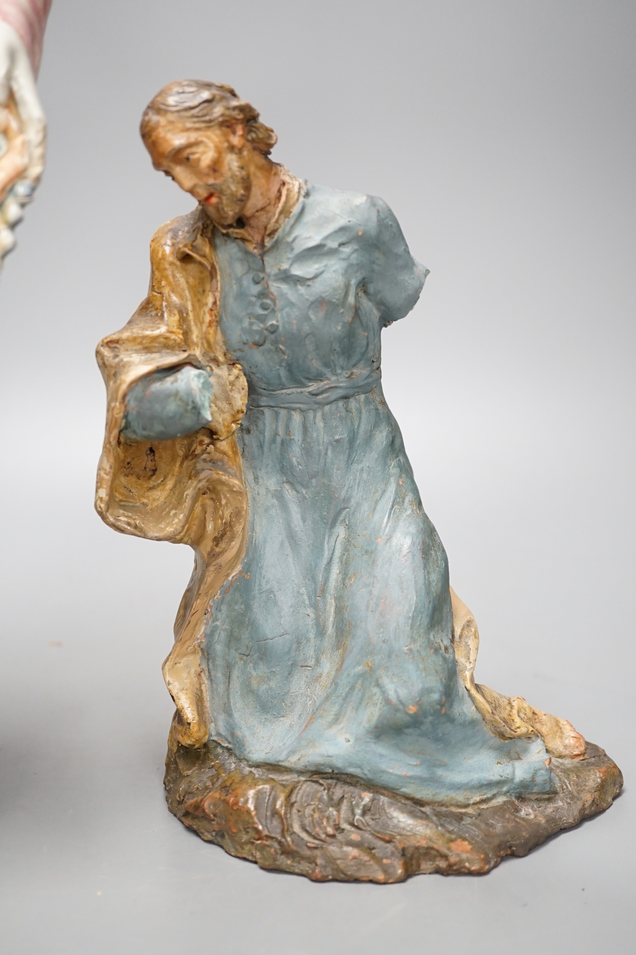 A late 19th century Italian maiolica figure of a Grecian woman or goddess with pipes and Sicilian terracotta figure of a Saint, tallest 38cm